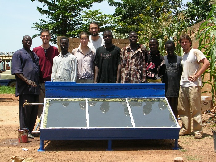 All the members of the TTA workshop in front of the water-heater