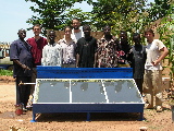 All the members of the TTA workshop in front of the water-heater