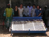 The district chief, Gwenola, Olivier, Ismaël, a friend, Daniel & Jan in front of the water-heater