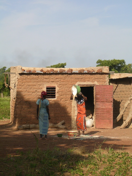 Two women in front of a house