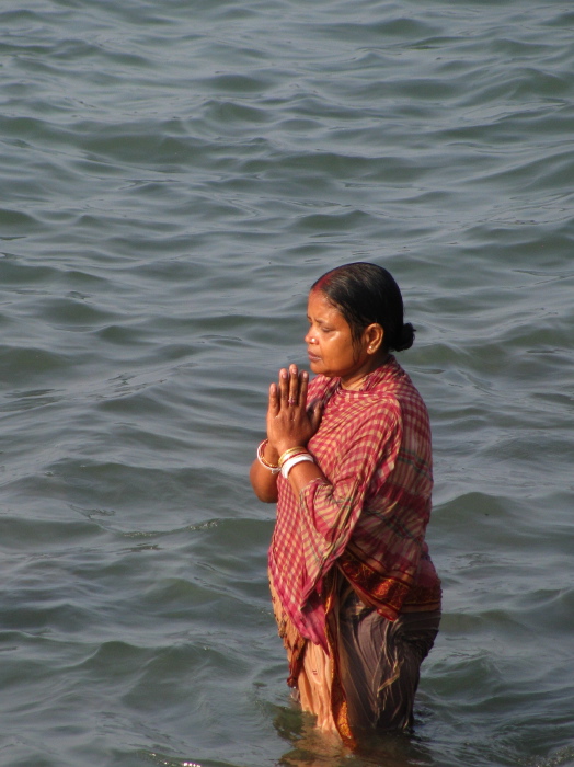 Indian woman doing a ritual purification