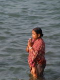 Indian woman doing a ritual purification