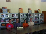 Kapil, Sylvain, Mrs Sarita Kaushik (principal) & Thimo in the library