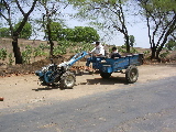 A tractor seen from the bus