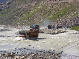 Trucks crossing the river