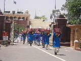 Pakistani and Indian bearers exchanging goods at the frontier