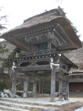 Small bell tower at the entry to a temple