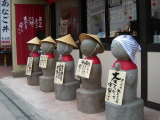 Statues in front of a shop