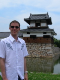 Thimo in front of a turret of the castle