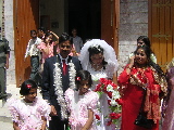 The groom & the bride outside the church